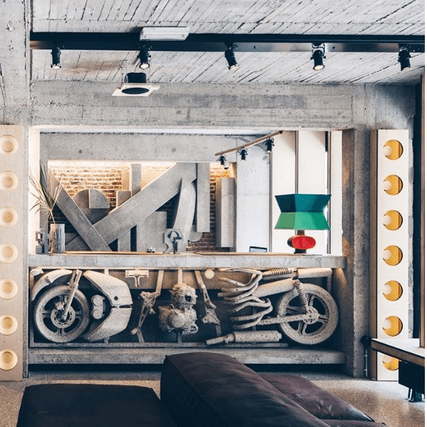 Jam hotel reception with concrete dipped motorcycles